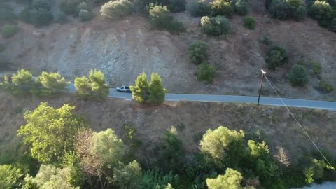 Top down aerial view of a pickup truck driving on an empty canyon road Stock Footage 343961183