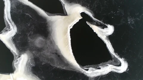 Top down aerial view of poor condition frozen lake 4k Stock Footage 117907996