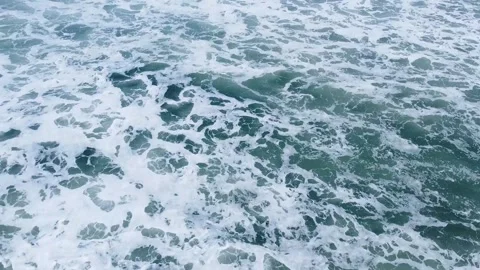 A top-down aerial view of a powerful and turbulent ocean, Ocean Power Stock-Footage 316833445
