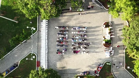 Top down aerial view of public gathering in urban plaza in Paraguay 스톡 동영상 335173299