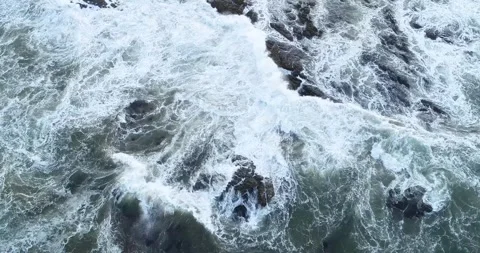 Top Down Aerial View of a Raging Sea on Rocks The Concept of a Natures Power Stock Footage 317842861