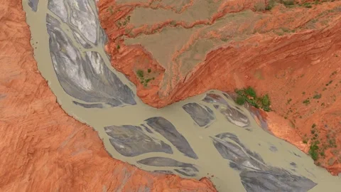 Top down aerial view of red canyon and braided muddy river in Xinjiang Stock Footage 345522018