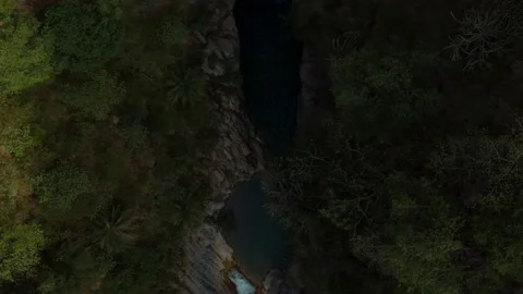 Top-down aerial view of a river flowing in between the mountains Stock Footage 172108280