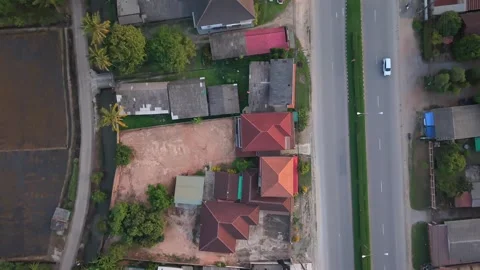 Top-down aerial view of a road and residential area in Asia Stock Footage 335425595