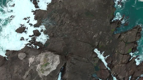 Top down aerial view of rock beach (first series) Stock Footage 147377409
