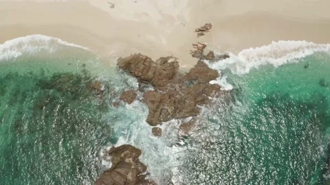 Top down aerial view of rocky beach coastline. Stock Footage 134595698