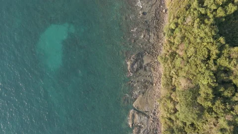 Top down aerial view of rocky beach Stock Footage 154455745