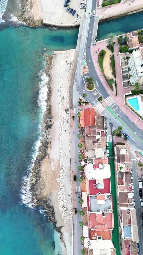 Top down aerial view of rocky coastline and townhouses, Javea, Spain Stock Footage 339989469
