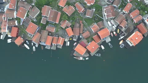 Top down aerial view of rooftops at costal island village Stock Footage 137872170