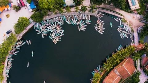 Top down aerial view of rowing boats taking tourists around sights of Ninh Binh Stock Footage 125527257