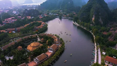 Top down aerial view of rowing boats taking tourists around sights of Ninh Binh Video stock 125527386