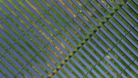 A top-down aerial view of rows of solar panels providing renewable energy Stock Footage 236749071