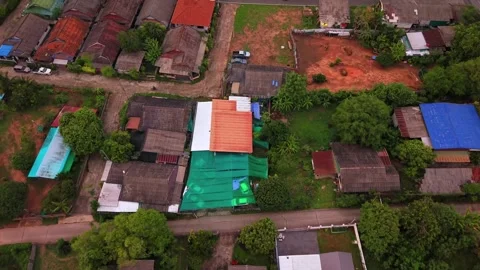 Top down aerial view of a rural village with colorful rooftops and local streets Stock-Footage 334925851