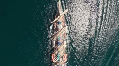 Top down aerial view of sail ship goes in the sea Video stock 277915300