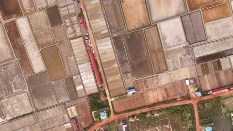 Top Down Aerial View of Salt Fields and Red Dirt Road, Kampot Cambodia Stock-Footage 347288857