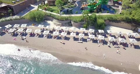 Top Down Aerial View of Sandy Beach Umbrellas and Turquoise Sea 4K 動画素材 344056952