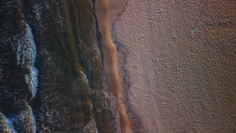 Top down aerial view of sea waves and sandy beach at sunrise in Crete Greece Stock Footage 337405065