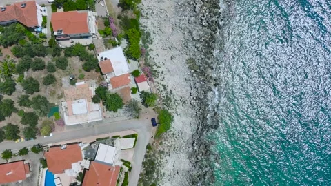 Top Down Aerial View of Seaside Houses and Rocky Shore, Greece Stock Footage 335643766