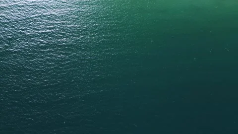 Top Down Aerial View of Shimmering Turquoise Ocean Water Surface Vidéo 333744483