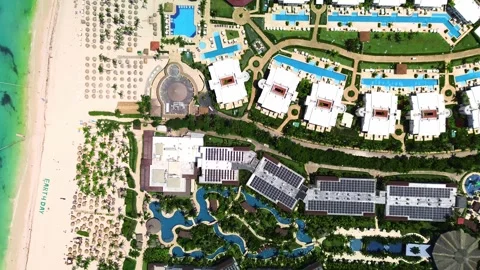 Top down aerial view of showcasing tropical resort lively swimming pool, family Stock Footage 274164927