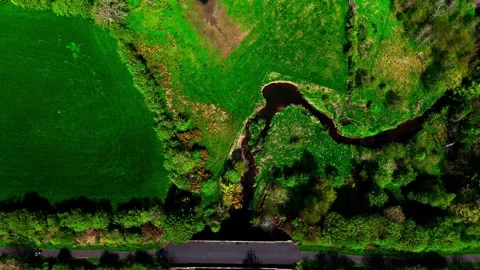 Top-Down Aerial View of Single-Track Road Crossing Rural Stream 库存影片 337310566