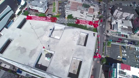 Top Down Aerial View of Skyscraper Construction Crane in Santo Domingo Stock Footage 342057384