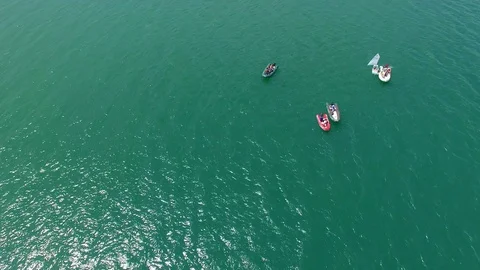 Top-down aerial view of small yachts and rubber boats Stock Footage 93573389