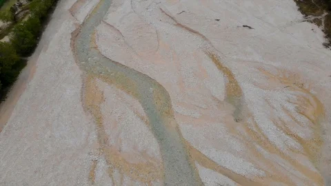 Top down aerial view of small river, gravel beach, overcast summer day Stock Footage 128110118