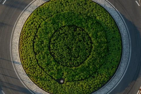 Top down aerial view of a small traffic roundabout. Stock Photos