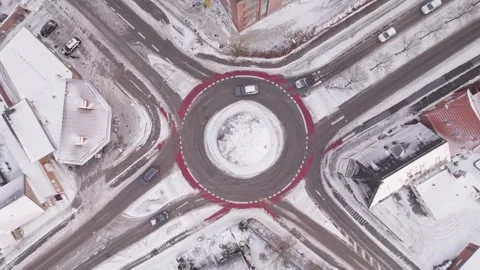 Top Down Aerial View of Snow Covered Roundabout in Herning City with Cars and 動画素材 331072062