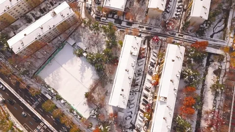 Top Down Aerial View of Snowy Apartment Complex in Winter 動画素材 325071318