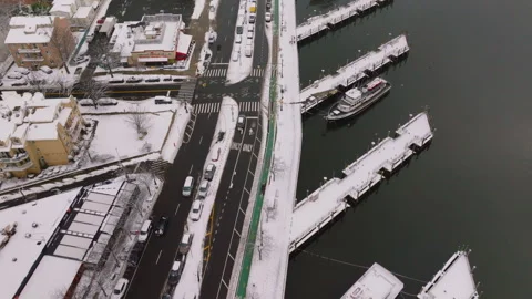Top down aerial view of snowy marina docks and boats, ProRes 422HQ footage Stock Footage 332694286