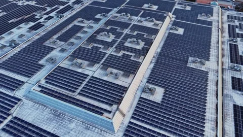 Top down aerial view of solar panels on industrial roof Stock Footage 338221091