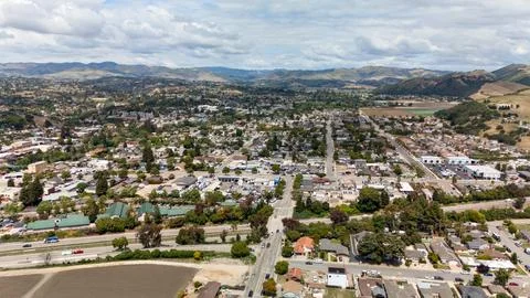 Top Down Aerial View of Solar Panel Parking Lot and Road Intersection Stock Photos