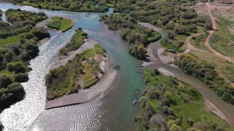 Top-down aerial view of a sparkling braided river, Kok-Moinok, Kyrgyzstan Stockbeeldmateriaal 347239793