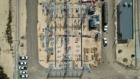 Top-down aerial view of a substation construction site with vehicles Stock Footage 278367861