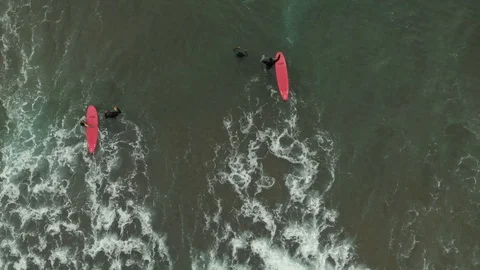 Top down aerial view surf instructors with pupils in ocean Video stock 108862135