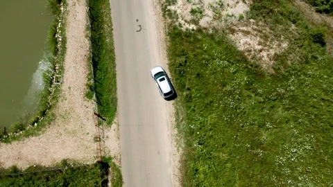 Top down aerial view of an SUV on a rural road Stock Footage 117278871