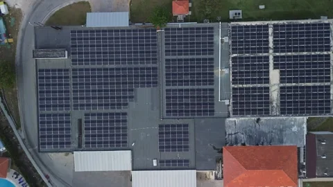 Top down aerial view of technical building with solar panels on flat roof Stock Footage 274485693