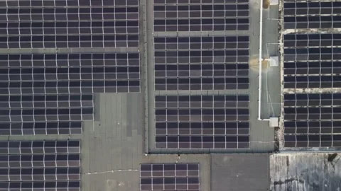 Top down aerial view of technical building with solar panels on flat roof Видео 274485736