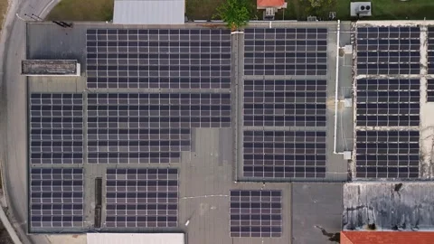 Top down aerial view of technical building with solar panels on flat roof Stock Footage 274485758