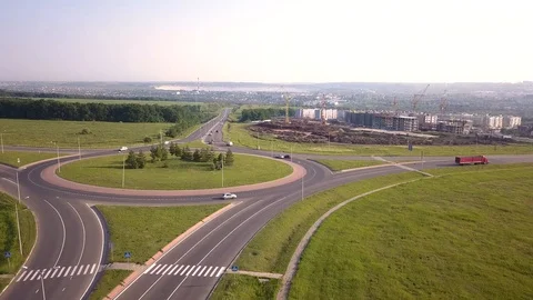 Top down aerial view of a traffic roundabout on a main road. Stock-Footage 109078402