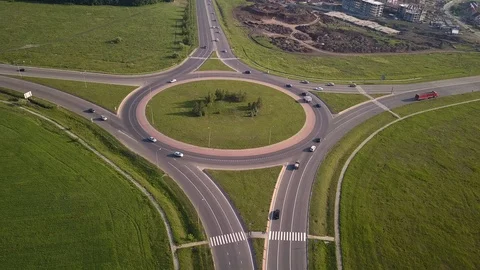 Top down aerial view of a traffic roundabout on a main road. Stock-Footage 109092738