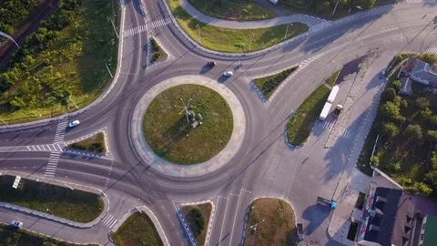 Top down aerial view of a traffic roundabout on a main road. 스톡 동영상 114745631