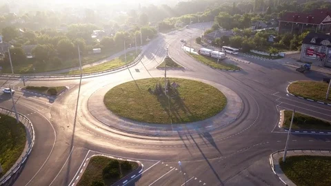 Top down aerial view of a traffic roundabout on a main road. Stock Footage 114746302