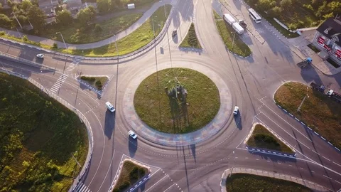 Top down aerial view of a traffic roundabout on a main road. Stock Footage 114758863