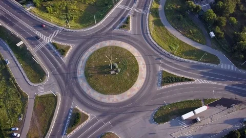 Top down aerial view of a traffic roundabout on a main road. Stock Footage 114759569