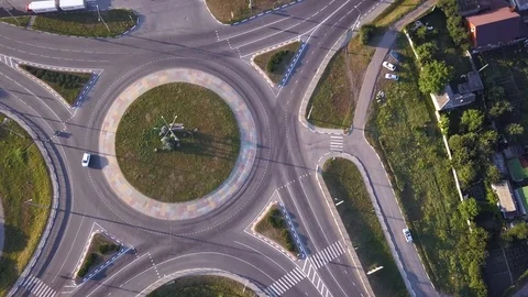 Top down aerial view of a traffic roundabout on a main road. Stock Footage 114759936
