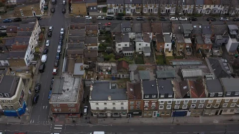 Top down aerial view of traffic and residential buildings in North London Stock Footage 129710800