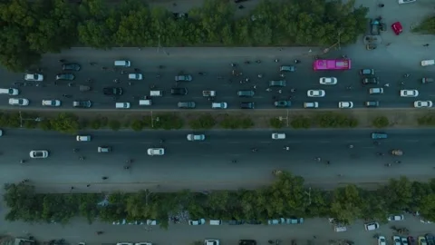 Top-Down aerial view of Traffic on Shahrah-e-Faisal road, Pakistan Stock Footage 260381111